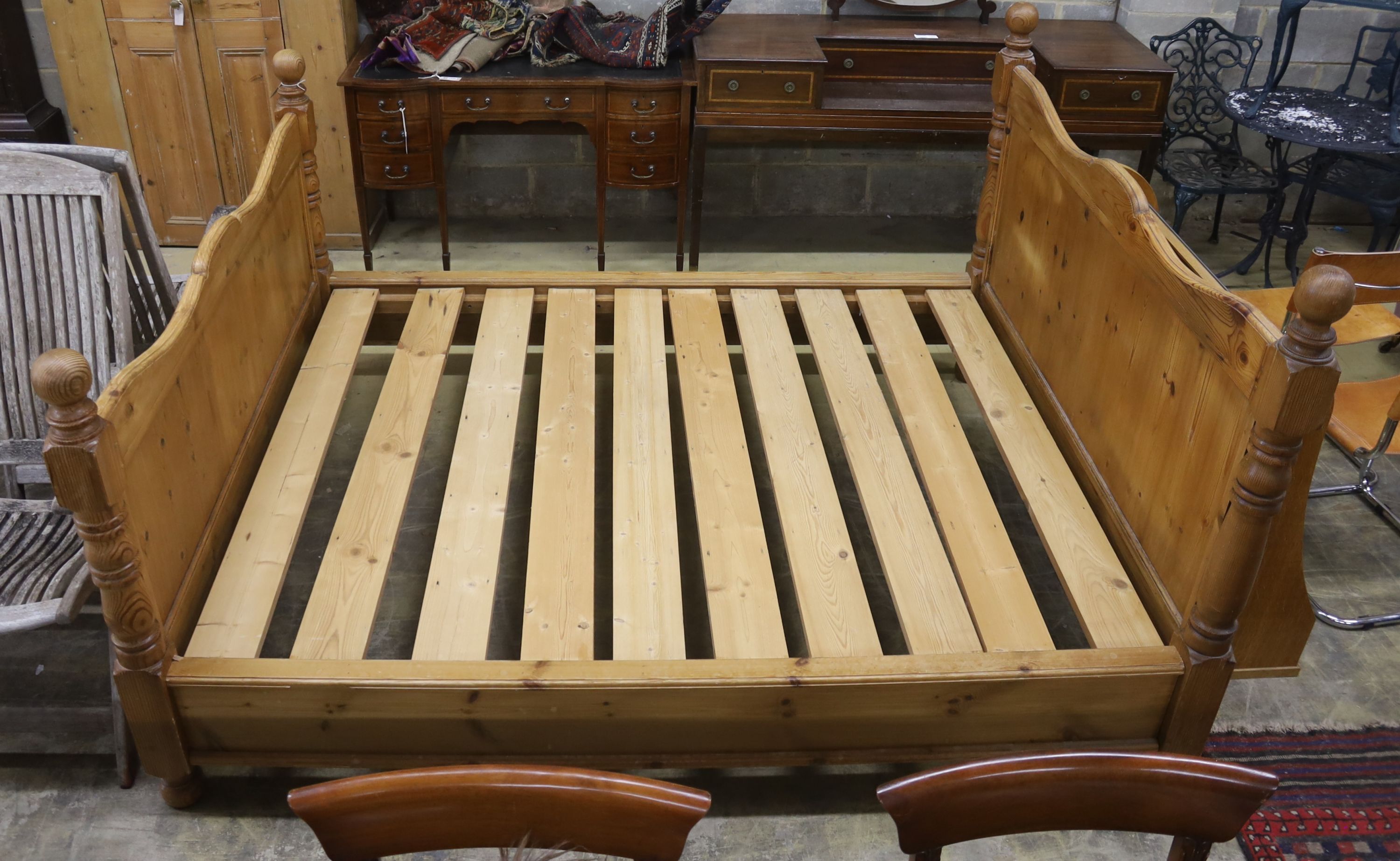 A king size pine bed frame with side rails and slats, width 170cm, length 213cm